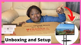 This just made life EASIER for me | Unboxing \u0026 Setup of the Yaheetech Mobile TV Stand | datnaijagirl