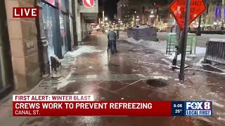 Crews work to prevent refreezing in the French Quarter