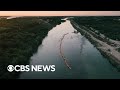 DOJ threatens to sue Texas over floating barrier in Rio Grande