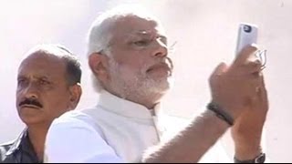 Narendra Modi takes a selfie after voting in Ahmedabad