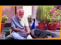 Precious moments: PM Modi feeding peacocks at his residence