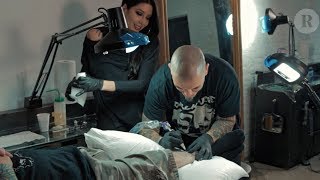 Pantera's Philip Anselmo Tattoos a Fan's Leg at East Side Ink