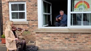 Woman Plays Violin For Her Isolated Grandad