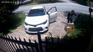 Video catches Amazon delivery person tossing packages over fence