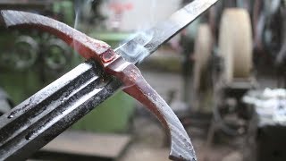 Forging a pattern welded Witcher 3 wolf sword, part 3,  hot fitting the guard
