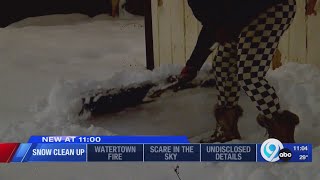 Syracuse residents continue snow clean up into Sunday night