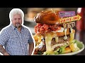 Guy Fieri Eats a Burger Topped with Hot Cheese Snacks | Diners, Drive-Ins and Dives | Food Network