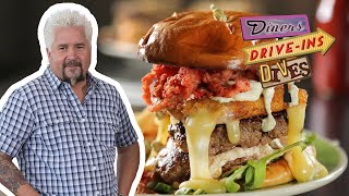Guy Fieri Eats a Burger Topped with Hot Cheese Snacks | Diners, Drive-Ins and Dives | Food Network