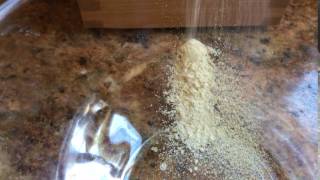 Making chickpea flour in a KoMo mill from Pleasant Hill Grain