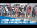 LGUs should not let people line up for COVID-19 vax in flooded areas  – Duterte