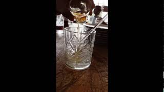 super slow motion of  alcohol in reverse