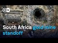 South African gold mine siege in third week | DW News