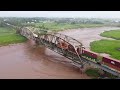 awesome 4k aerial view long stack train cn 120 crossing bridge over tantramar river sackville nb