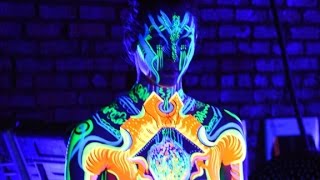 3-D neon bodypaint illuminates dancers