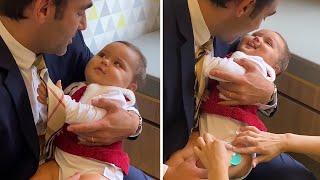 Dad adorably distracts baby during doctor's visit