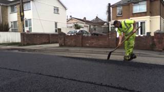 CORMAC Surfacing team relaying a new road surface in Bude, Cornwall