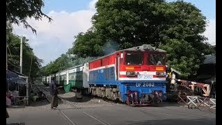 Myanmar Railways (Burma), a passenger train at a busy crossing, having exiting Mandalay Station.