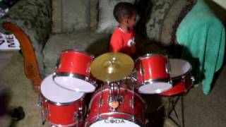 a'kemi playing drums