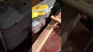 How we use the belt sander to smoothen ends on the rattan poles.