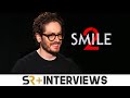 Smile 2 Director On Bigger, Bloodier Sequel To Viral Horror Hit & Potential For Smile 3