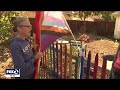 Pride flag stolen from East Bay home, family and friends paint fresh rainbow fence