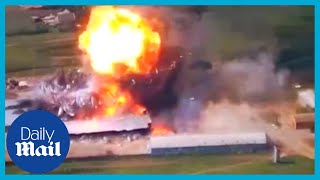 Shocking moment Ukraine bombs Russian army warehouse sky high