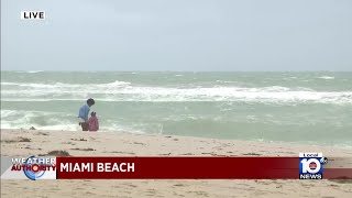 Tourists react to unexpected weather in South Beach