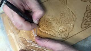 The process of stamping the wolf. The process of stamping on the skin of vegetable tanning