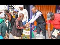 Rev Ben Kiengei feeds a crowd of needy less fortunate in society at Jcm.