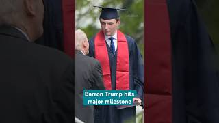 Barron Trump towers over his high school officials at his graduation, as President Trump cheers on