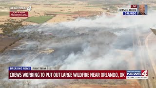 Firefighters battle wildfire in Orlando, OK