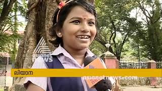 8 year old Leana from Aluva helps poor in need on her way to school