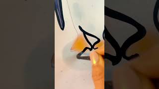 Painting a cute pair of penguins in one single line of black ink without lifting my paintbrush