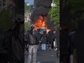 Smoke rises from the distance as protesters in Belfast set bus ablaze | Northern Ireland