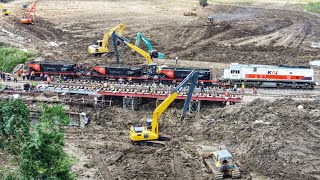 KEMBALI BERDATANGAN KERETA ANGKUTAN BATU UNTUK MENUANGKAN MUATANNYA DI JEMBATAN SEMENTARA.