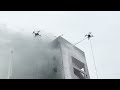 extinguishing a fire on the facade with two firefighting drone