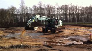 Wheel Excavator Doosan DX190 Spinning while watering the soil