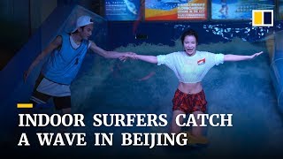 Indoor surfers, or flowboarders, catch a wave in Beijing