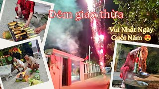 The Moment of New Year's Eve: The Whole Family Watching Over Banh Tet Cakes and Setting Off Firew...