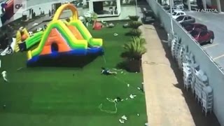 Wind sends inflatable bounce house flying