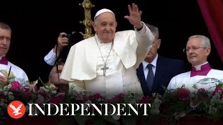 Pope Francis waves from Vatican balcony after leading Easter Mass