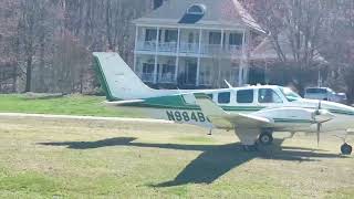 Beechcraft Baron 58 landing on grass runway