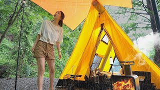 Solo camping in a mess in a leaky inflatable tent in heavy rain