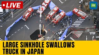 Live:  japan | Rescuers attempt to recover truck swallowed by sinkhole | N18G