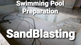 Sandblasting a swimming pool surface preparation