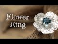 Creating a silver flower ring.