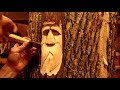 woodspirit woodcarving practice carving a face in a cedar log