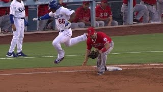 Puig and Pujols get feet tangled at first