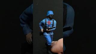 Army men, painting an Airfix WW2 German Wehrmacht like a GIJoe COBRA Trooper