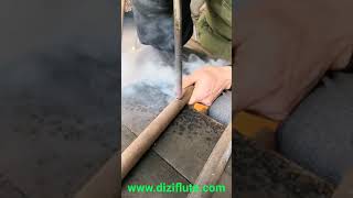 How to make dizi flute-Drill hole with Iron(www.diziflute.com) @Dan Tang